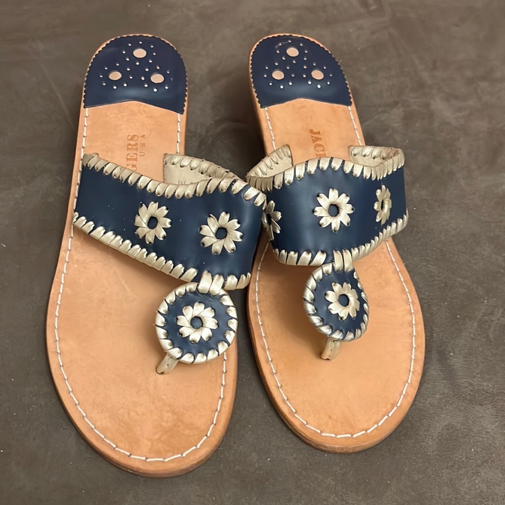 Jack Rogers wedge sandal. Navy with gold/bronze accents.